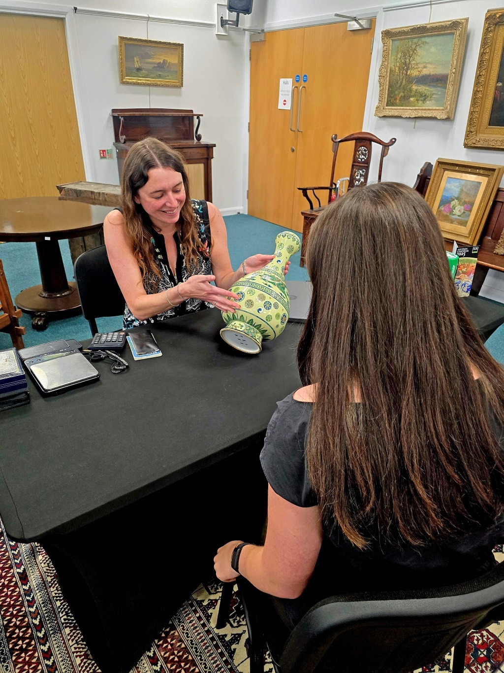 Maryanne Lineker-Mobberley valuing a vase. Halls Fine Art